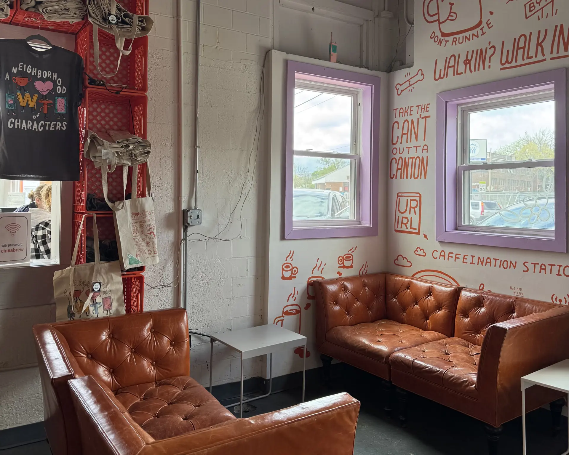 orange couches and white walls at Walkie Talkie