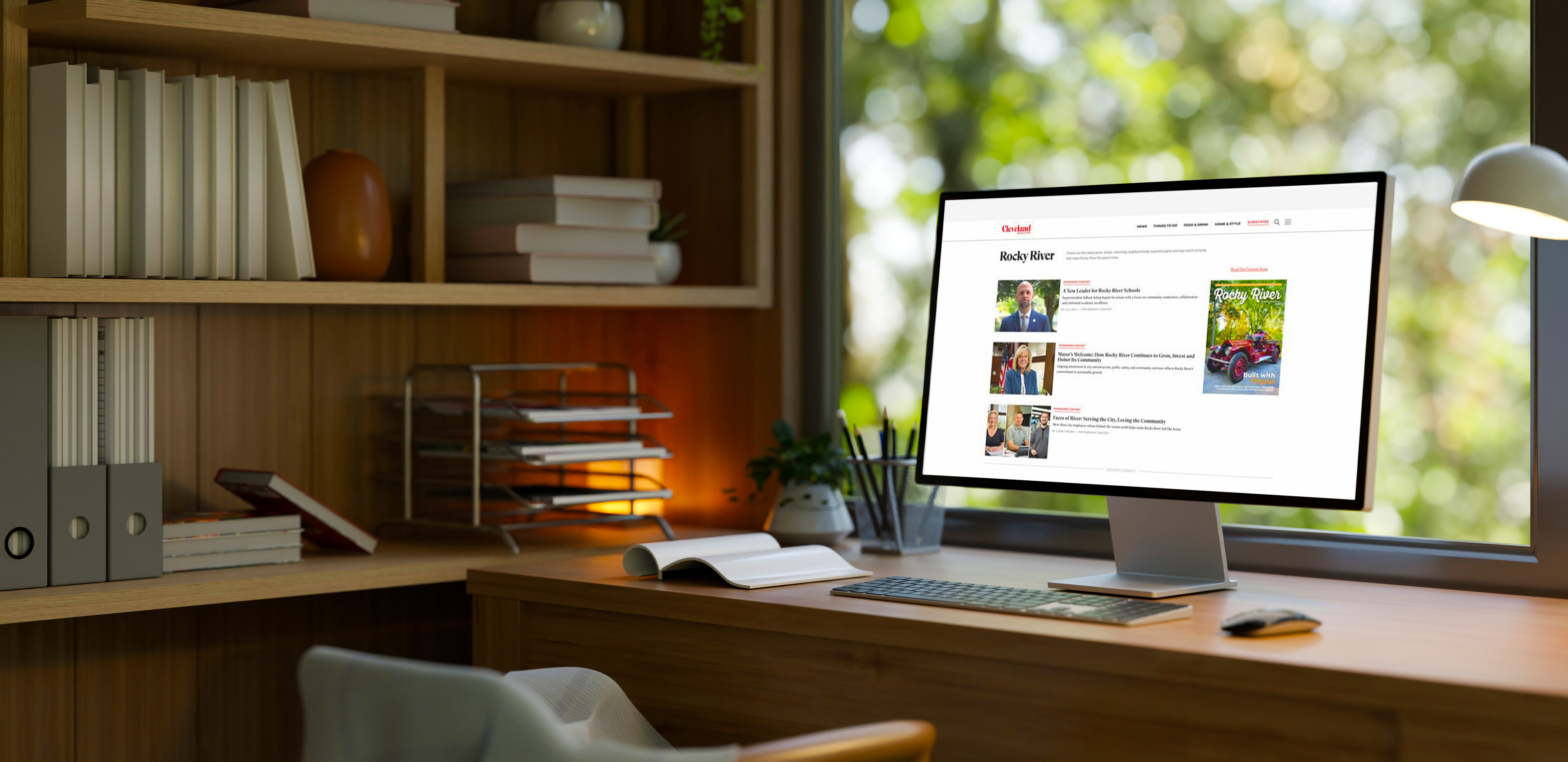 a desktop computer sitting on a desk showing Rocky River stories on Cleveland Magazine's website
