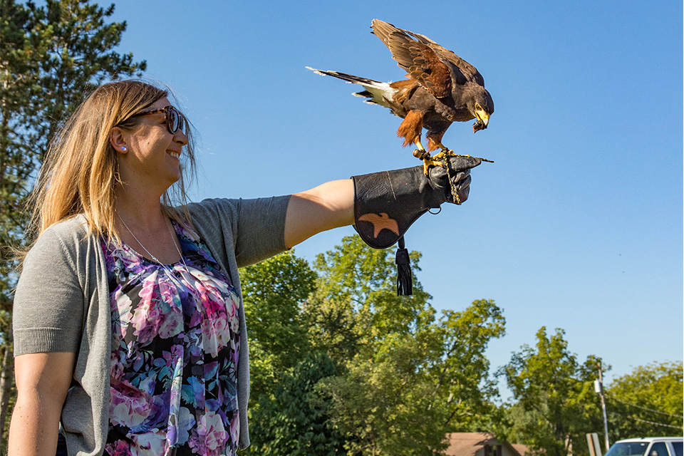 Woman holding bird at Ohio School of Falconry