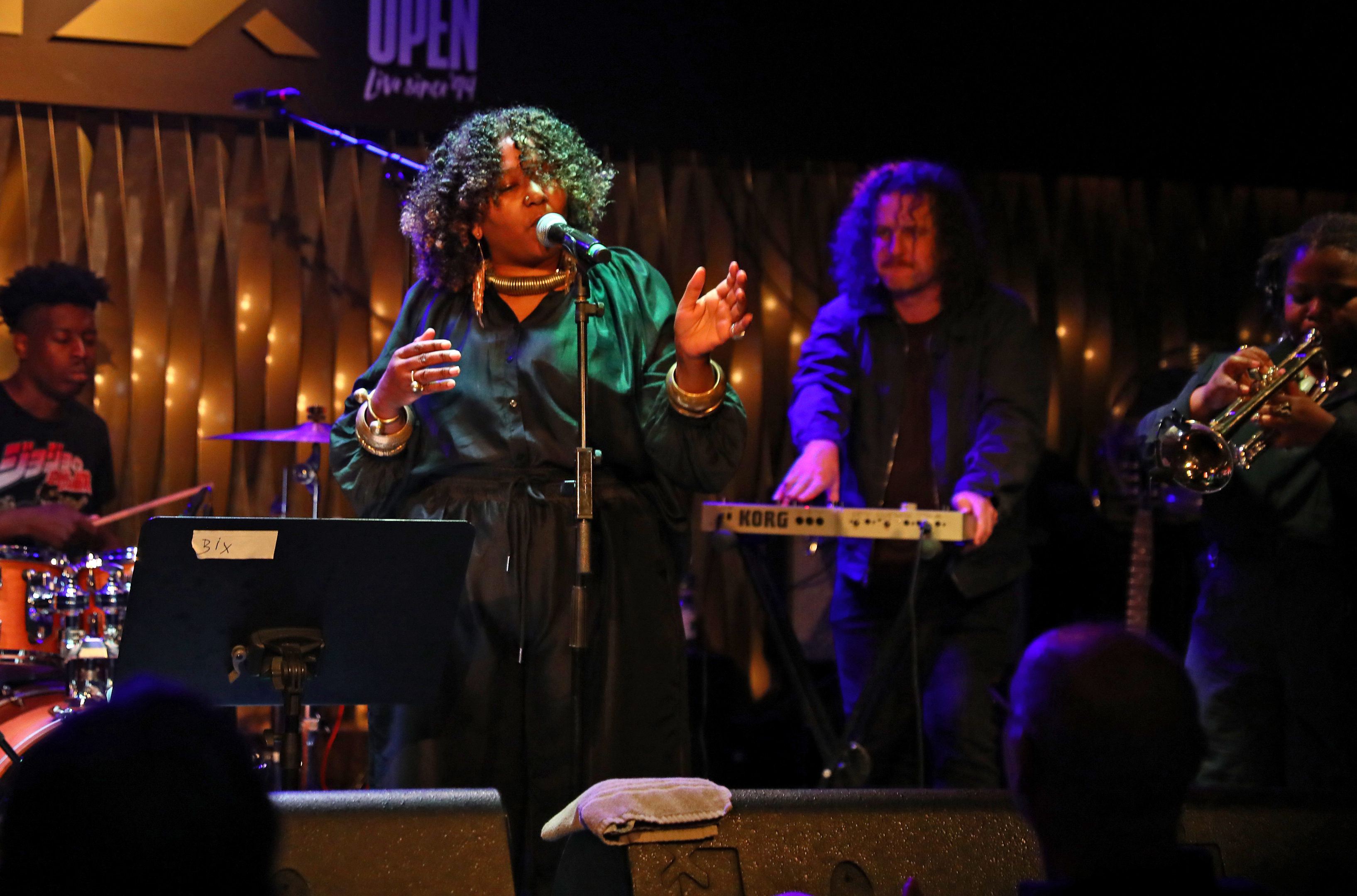 Band singing and performing onstage