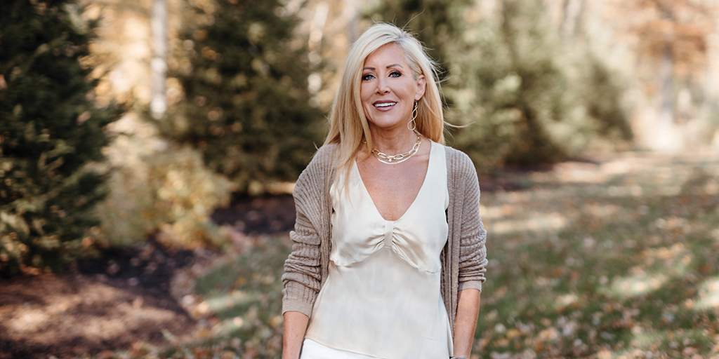 Woman posing for a photograph.