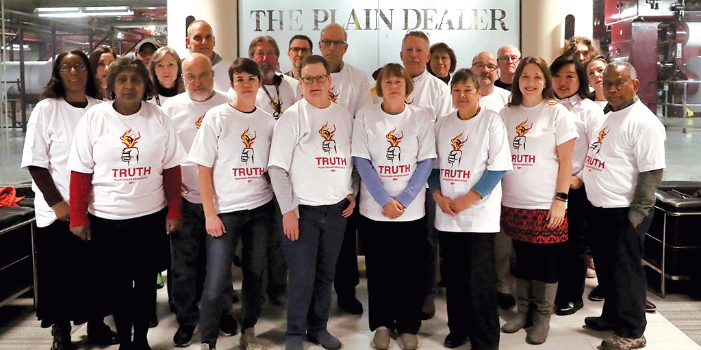 Reporters wearing union t-shirts.