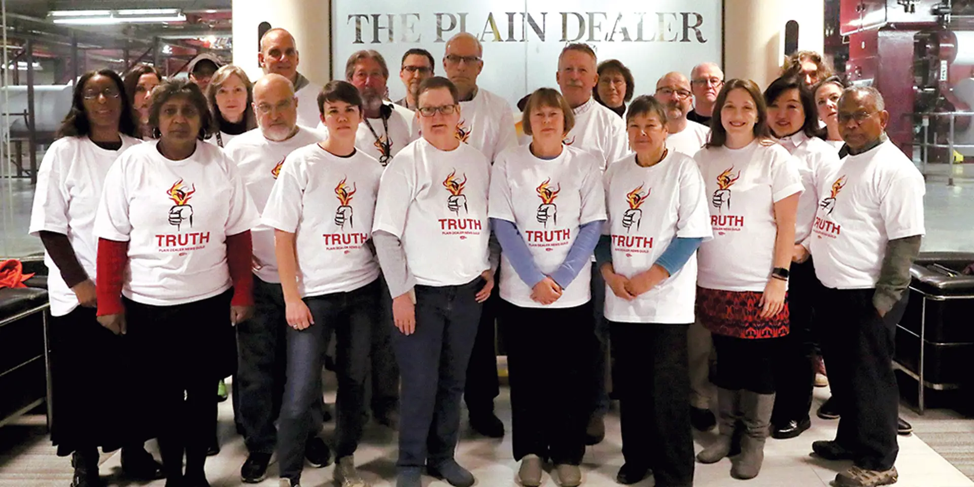 Reporters wearing union t-shirts.