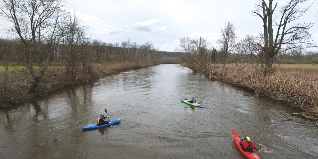 Writer Sheehan Hannan (green kayak) paddles through the Cuyahoga Valley National Park.