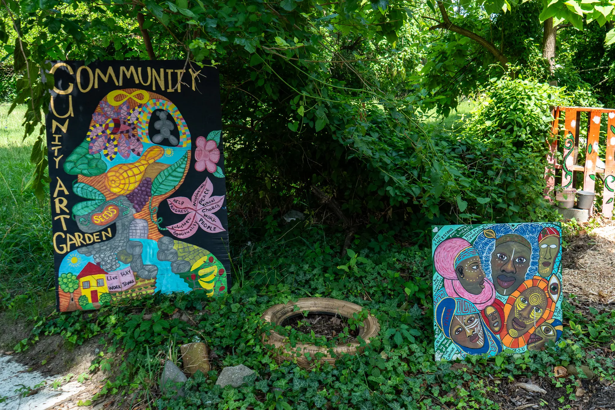 "Community" murals with face illustrations.
