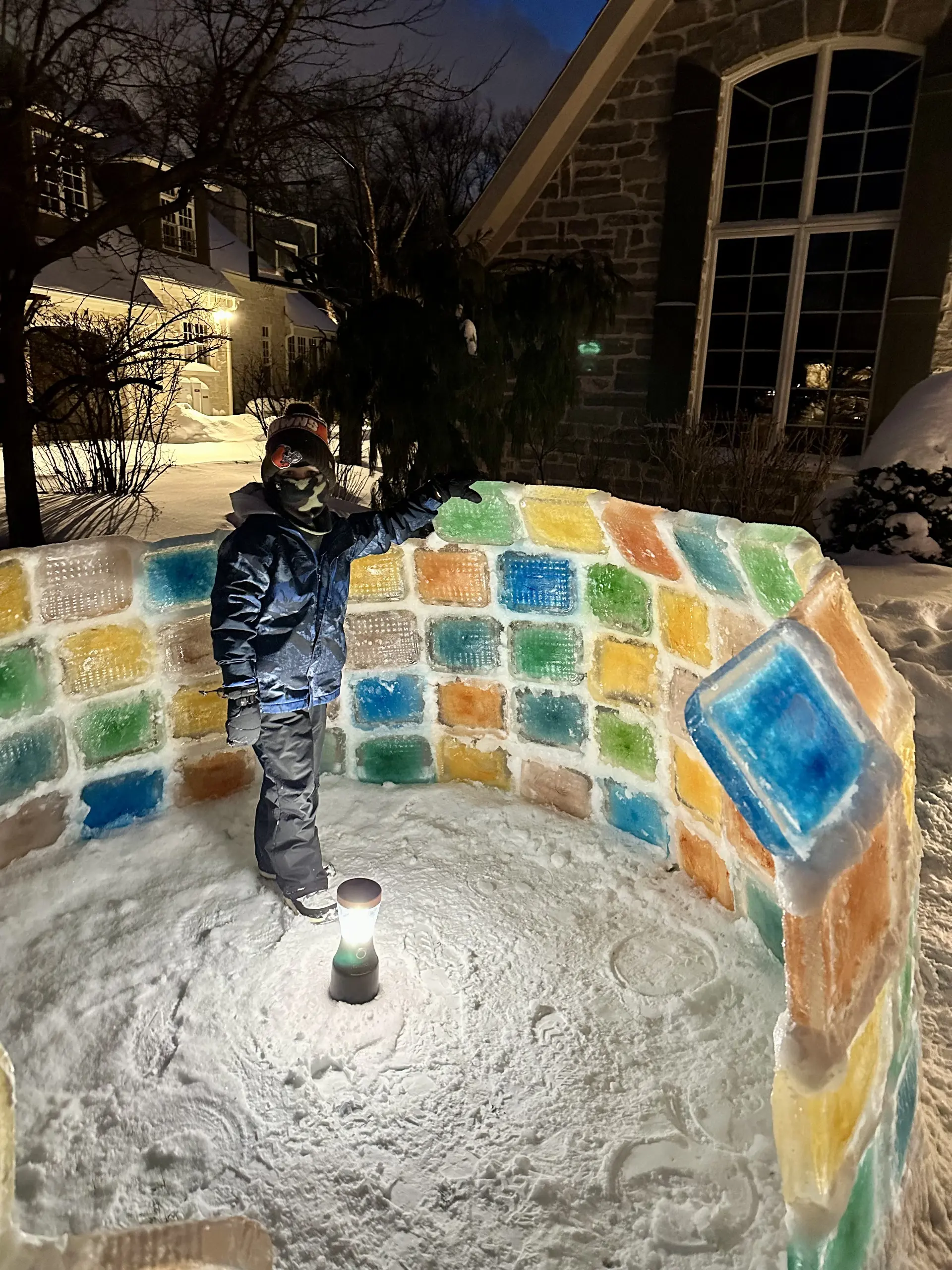 Person building an igloo.