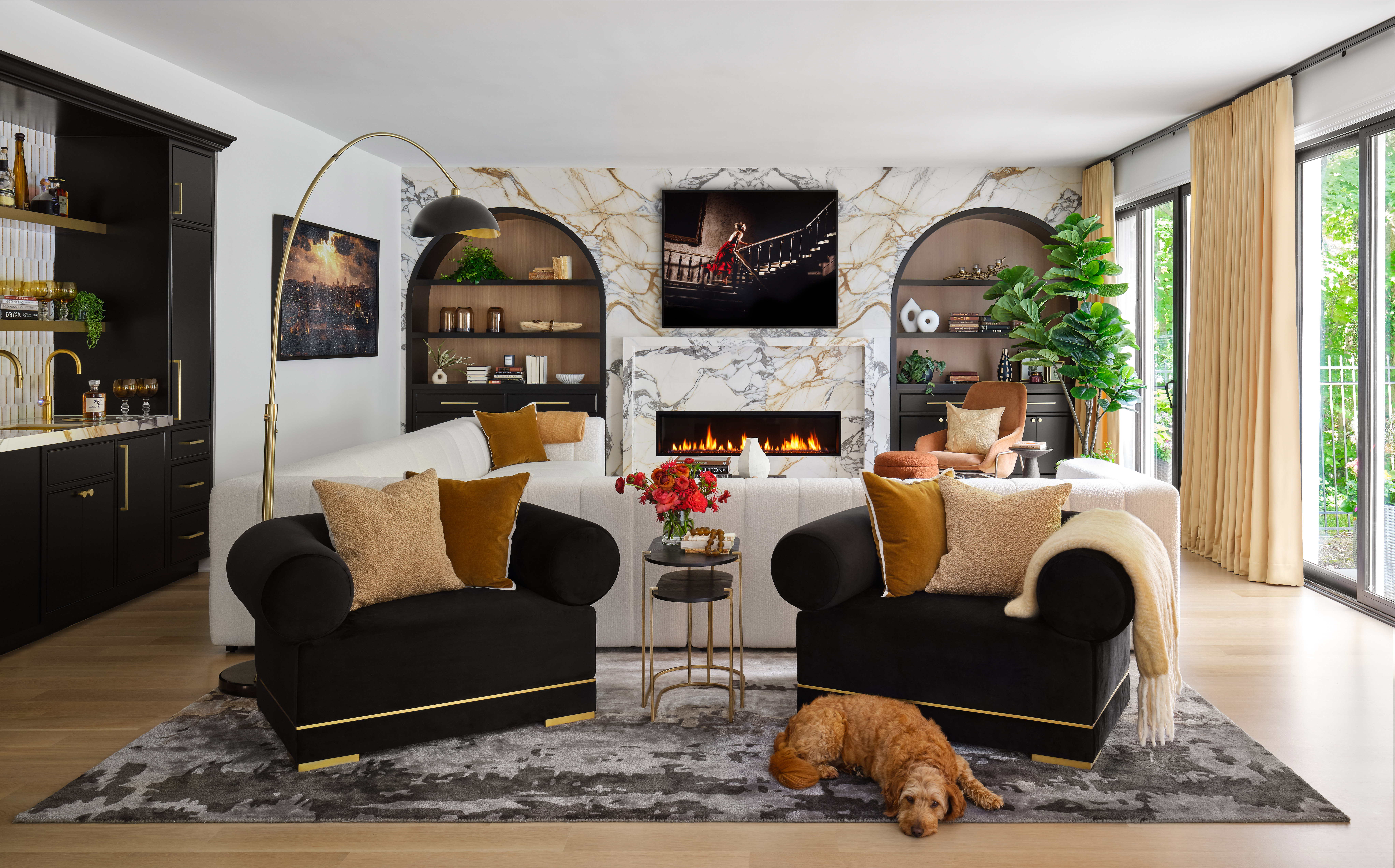 White and gold great-room with bookcases are backed white oak.