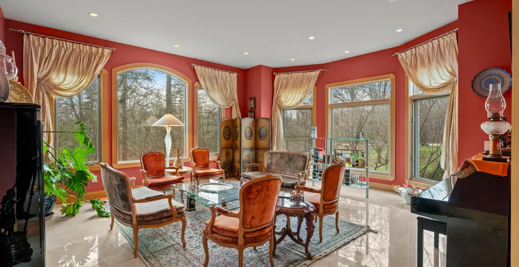 red den with red chairs and small cocktail bar