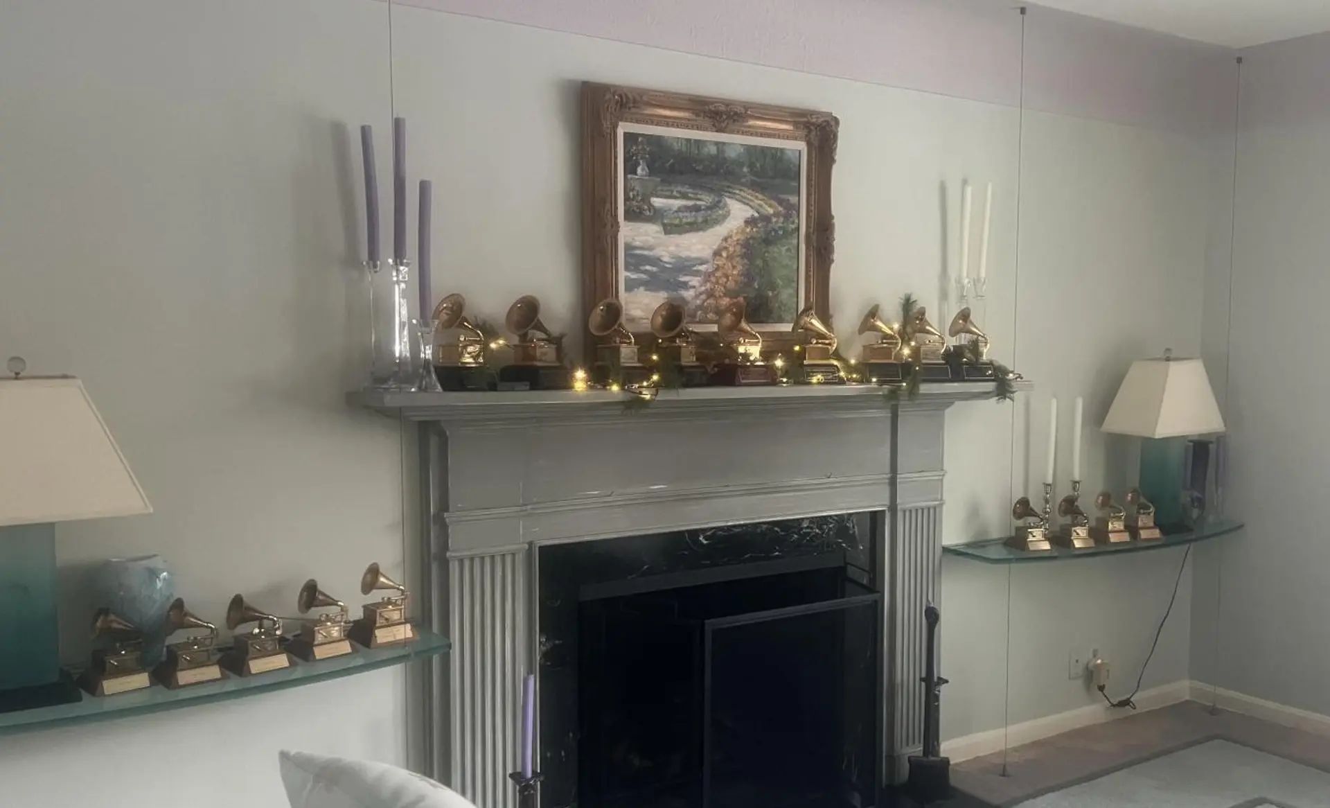Mantel with many Grammy awards lining it.