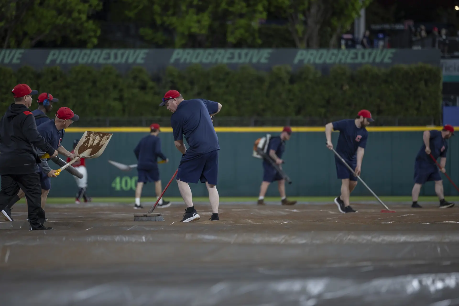 Guardians' groundskeepers prep the infield together. 