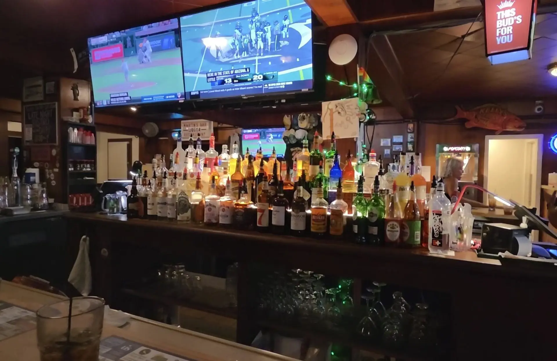Bar with TVs above it