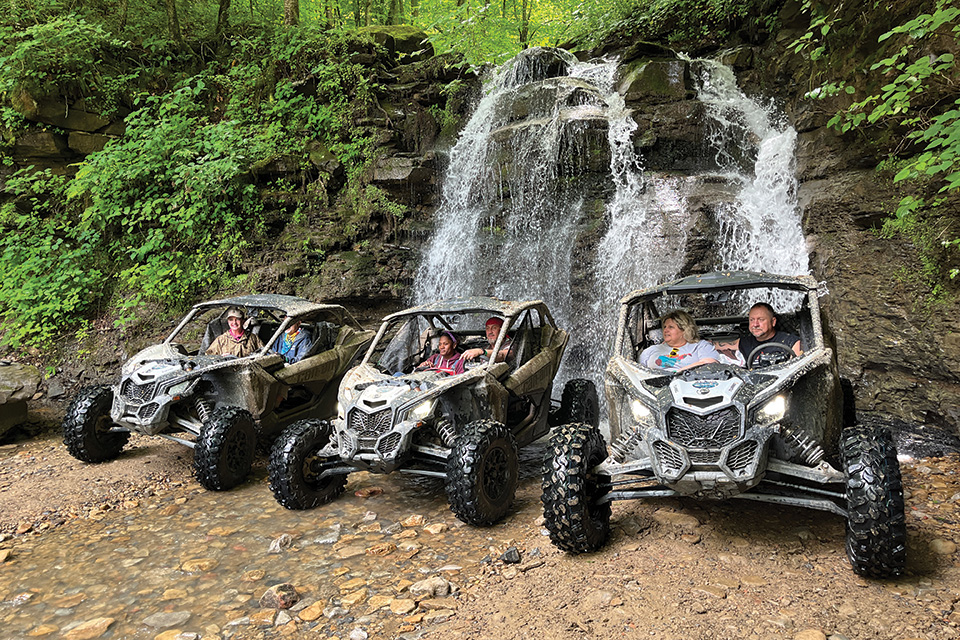 People in all-terrain vehicles on the Hatfield-McCoy Trails in West Virginia (photo by Tom Adkinson) People in all-terrain vehicles on the Hatfield-McCoy Trails in West Virginia (photo by Tom Adkinson)
