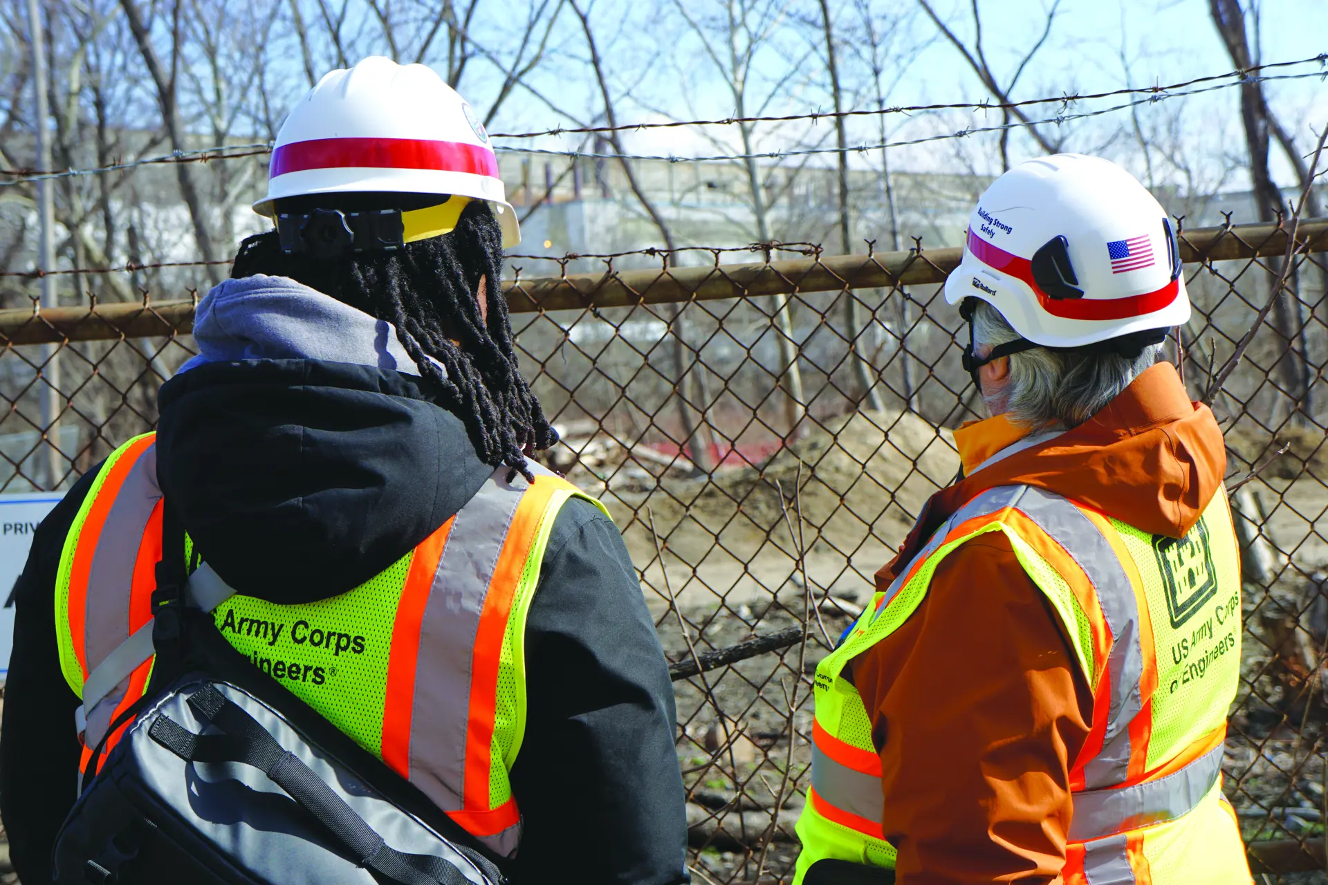 Two Army Corps employees look over a portion of the Harshaw Chemical Co. site.