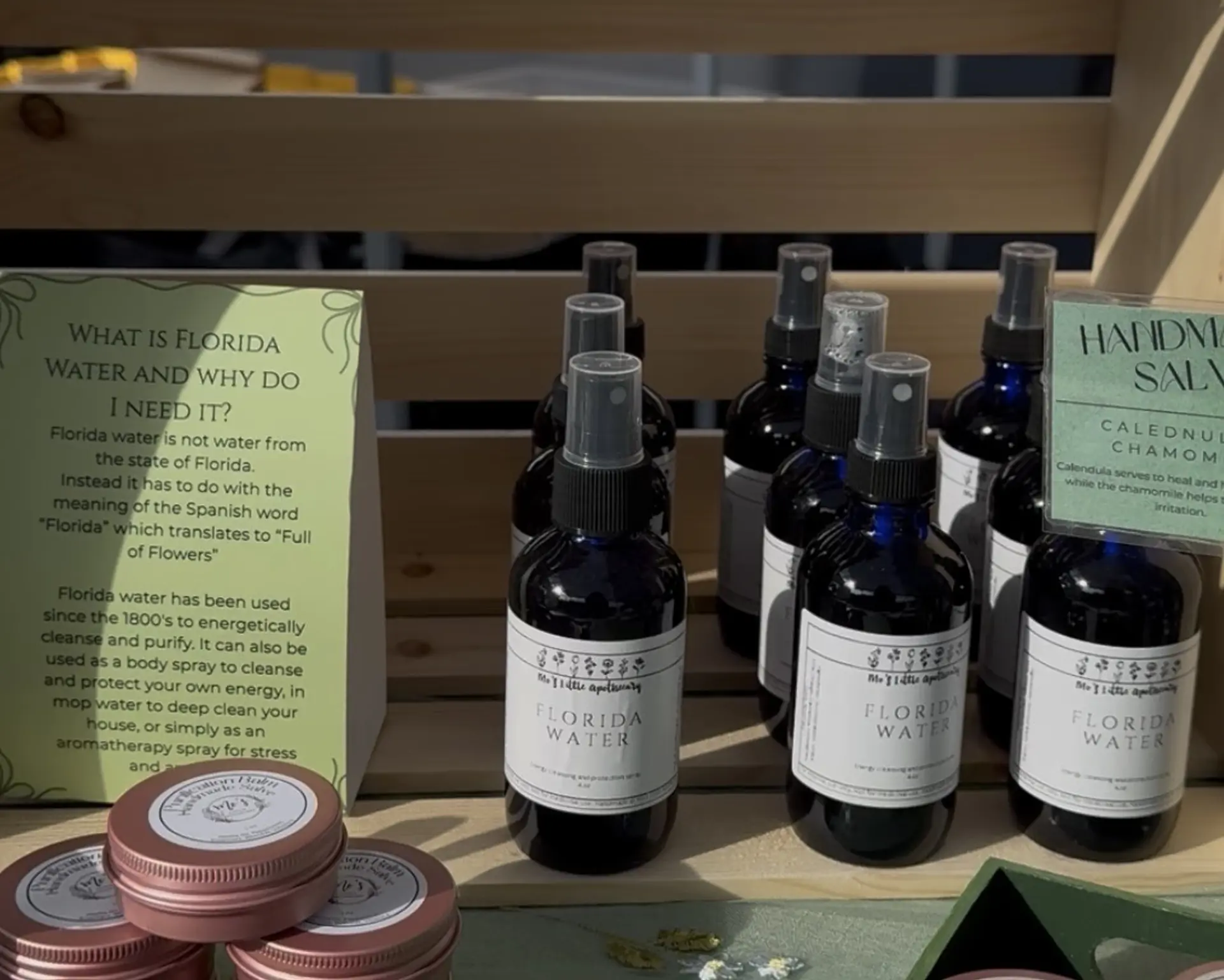 spray bottle of Florida Water on a wooden shelf
