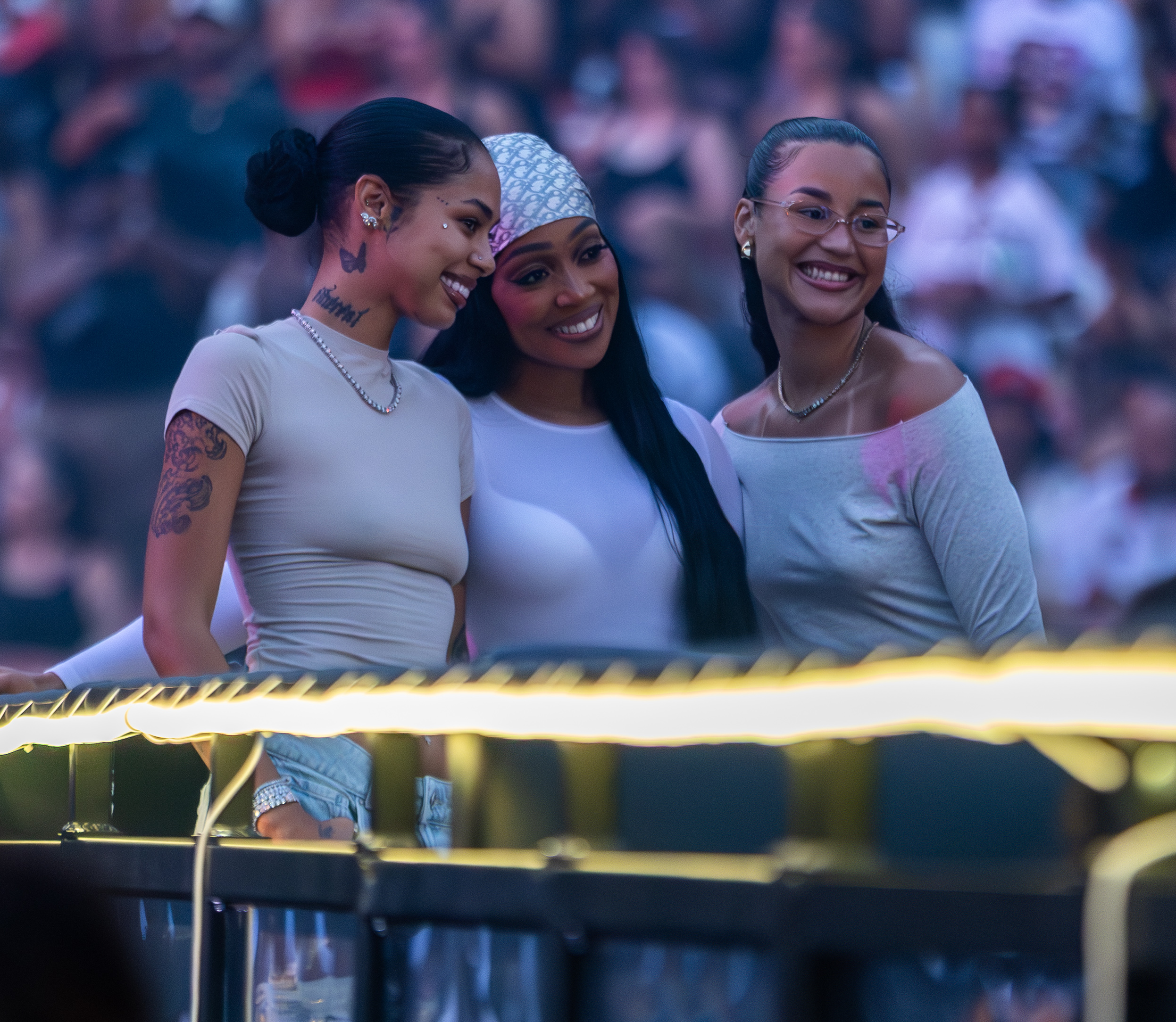 Fans pose for a photo at the Chris Brown and Usher concert