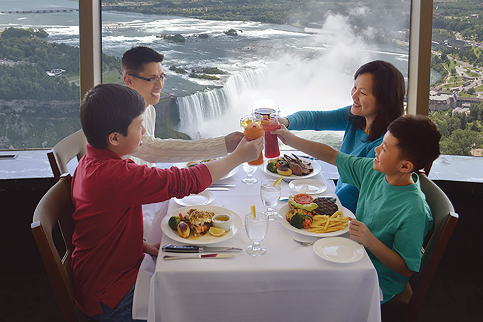 Family enjoying dinner at Skylon Tower's Revolving Dining Room in Niagara Falls, Ontario (photo courtesy of Skylon Tower) Family enjoying dinner at Skylon Tower's Revolving Dining Room in Niagara Falls, Ontario (photo courtesy of Skylon Tower)