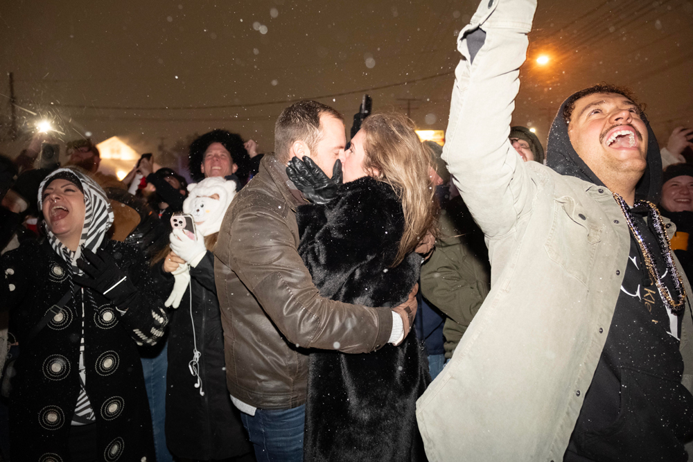A couple kisses as a pierogi drops in Parma at midnight on New Year’s Eve