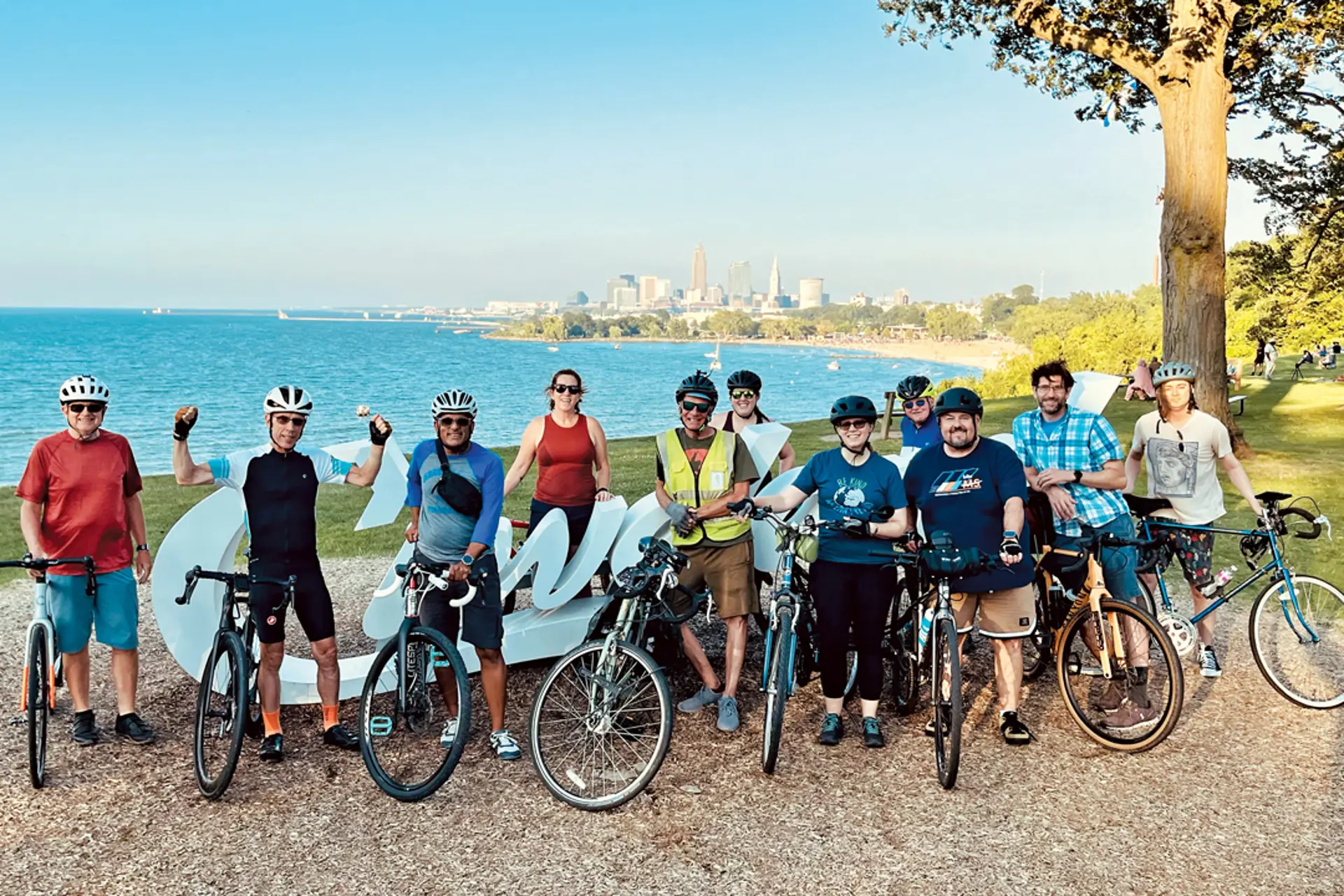 A group of people standing with bikes