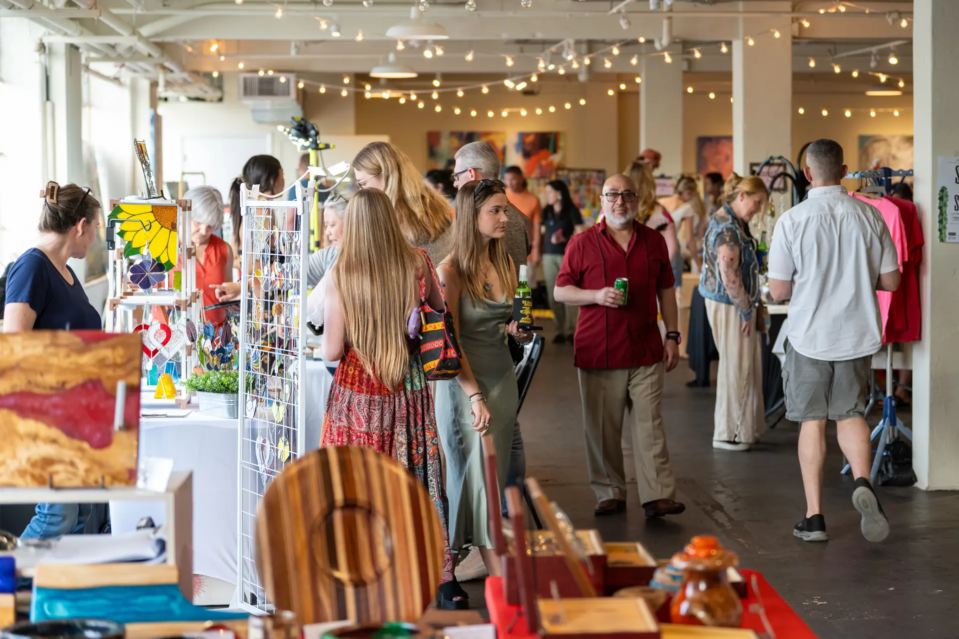people shopping at a vendor market at 78th Street Studios