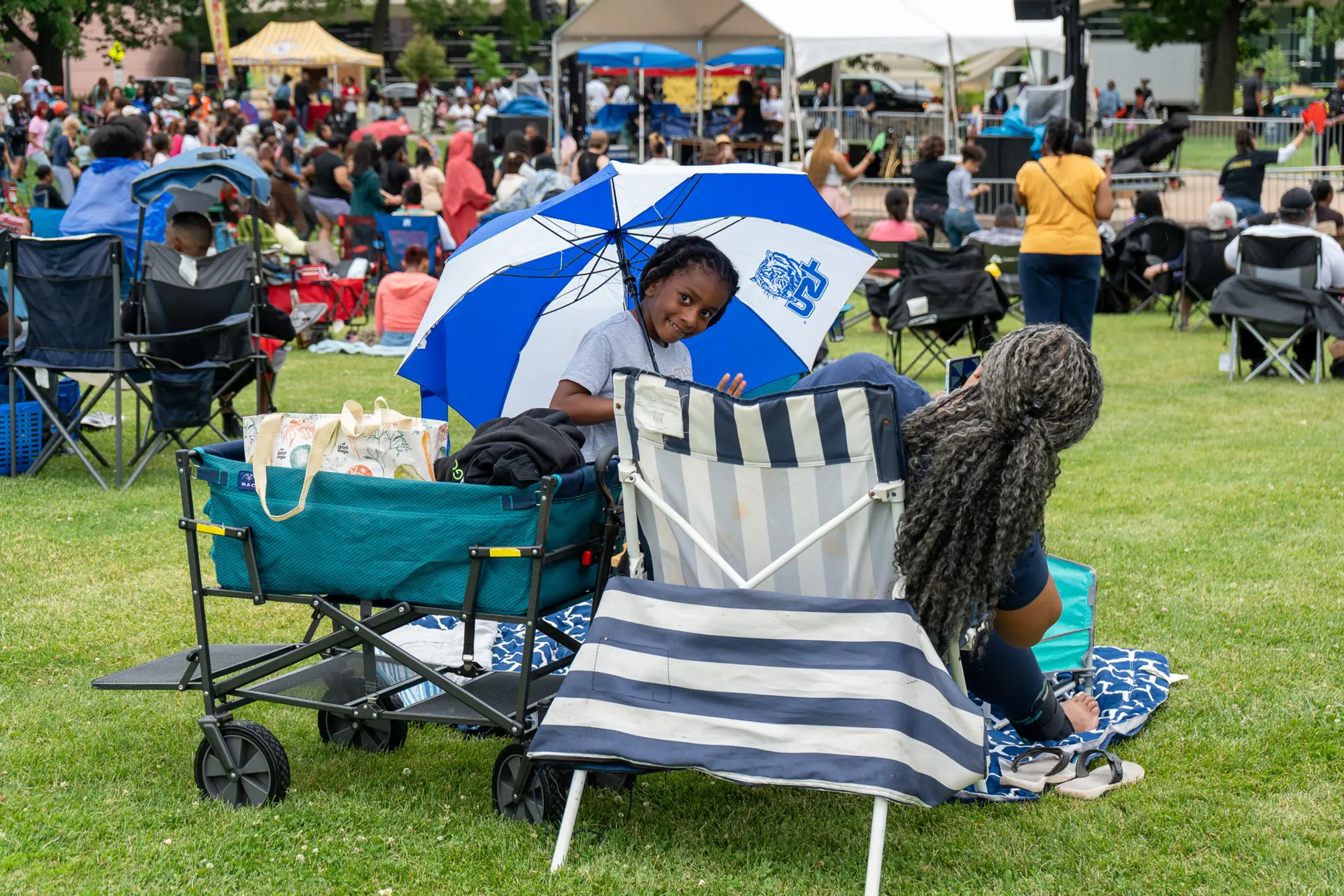 Kid under an umbrella at Wade Oval Wednesday
