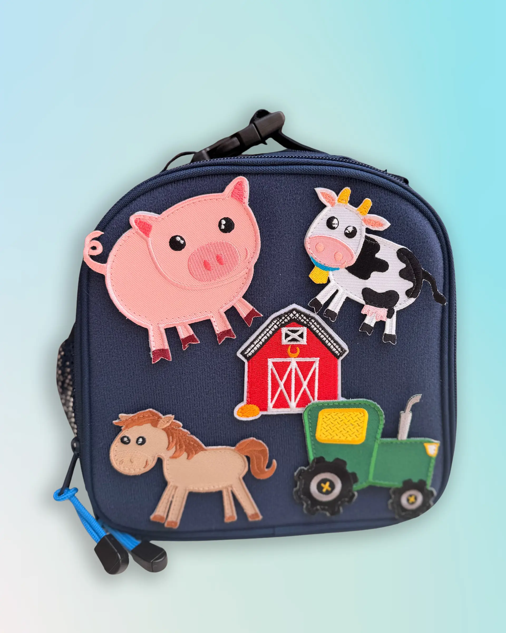 navy lunchbox with farm-themed patches