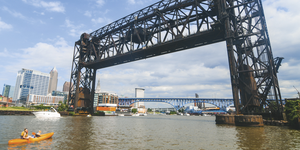 Kayakers, rowers and freighters all share the river in Cleveland’s Flats.