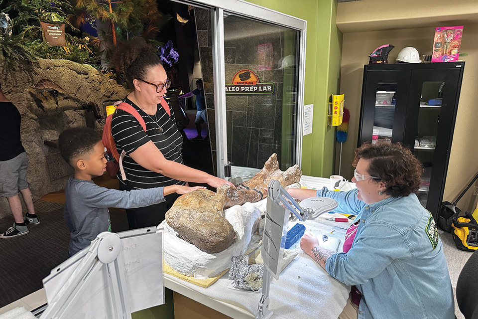 Mom and son looking at artifacts at The Children’s Museum of Indianapolis in Indianapolis, Indiana (photo courtesy of The Children’s Museum of Indianapolis) Mom and son looking at artifacts at The Children’s Museum of Indianapolis in Indianapolis, Indiana (photo courtesy of The Children’s Museum of Indianapolis)