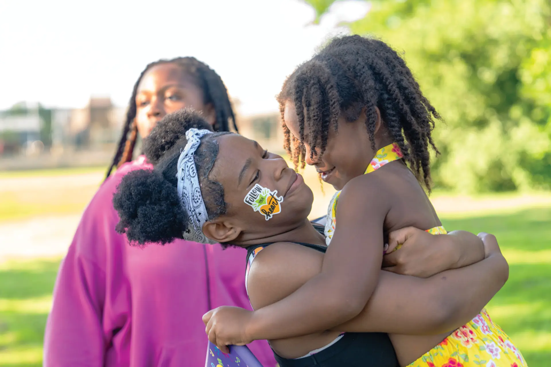 Kids hugging at Solon's Celebrate Juneteenth event
