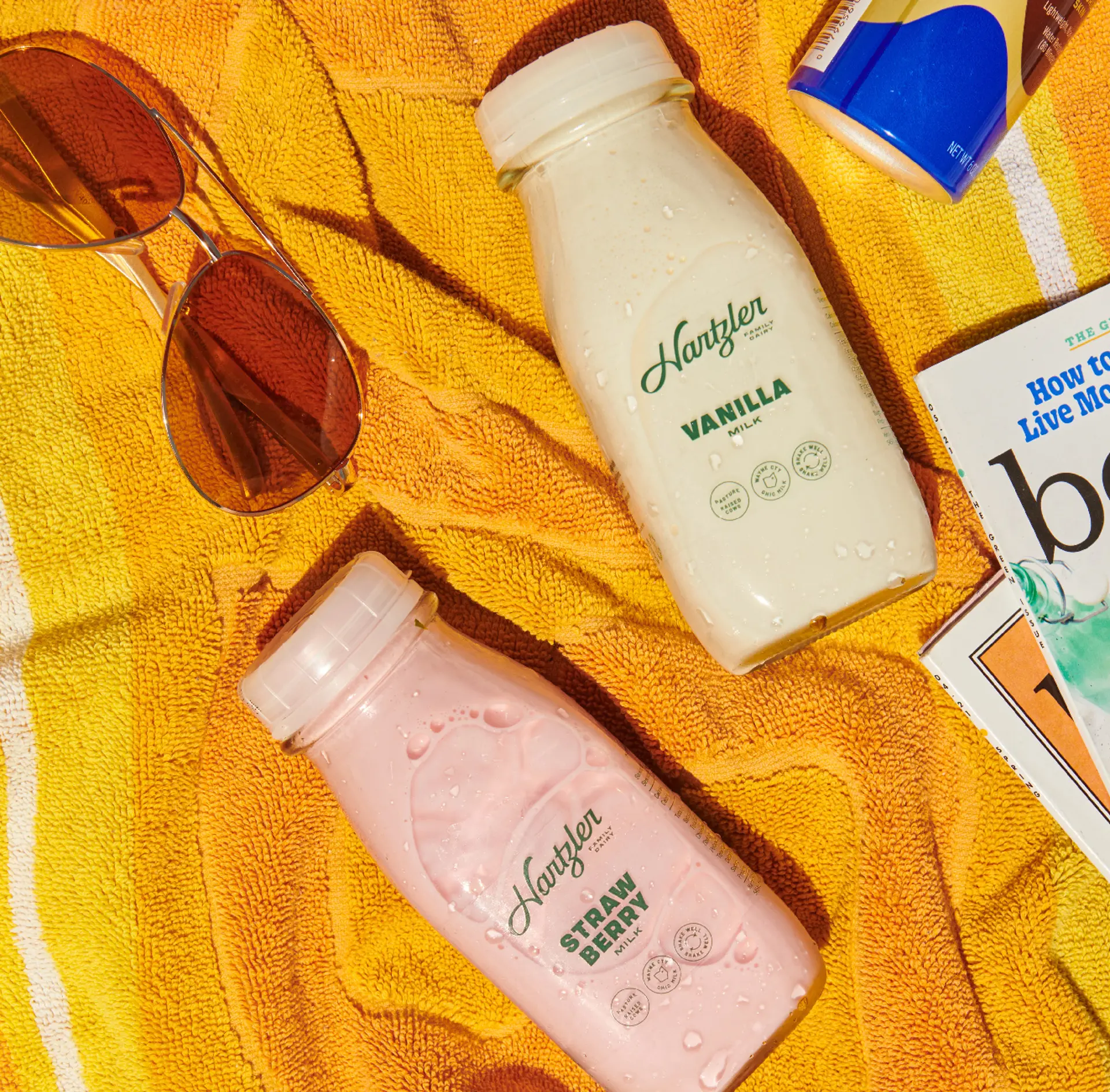 milk jars on a beach towel