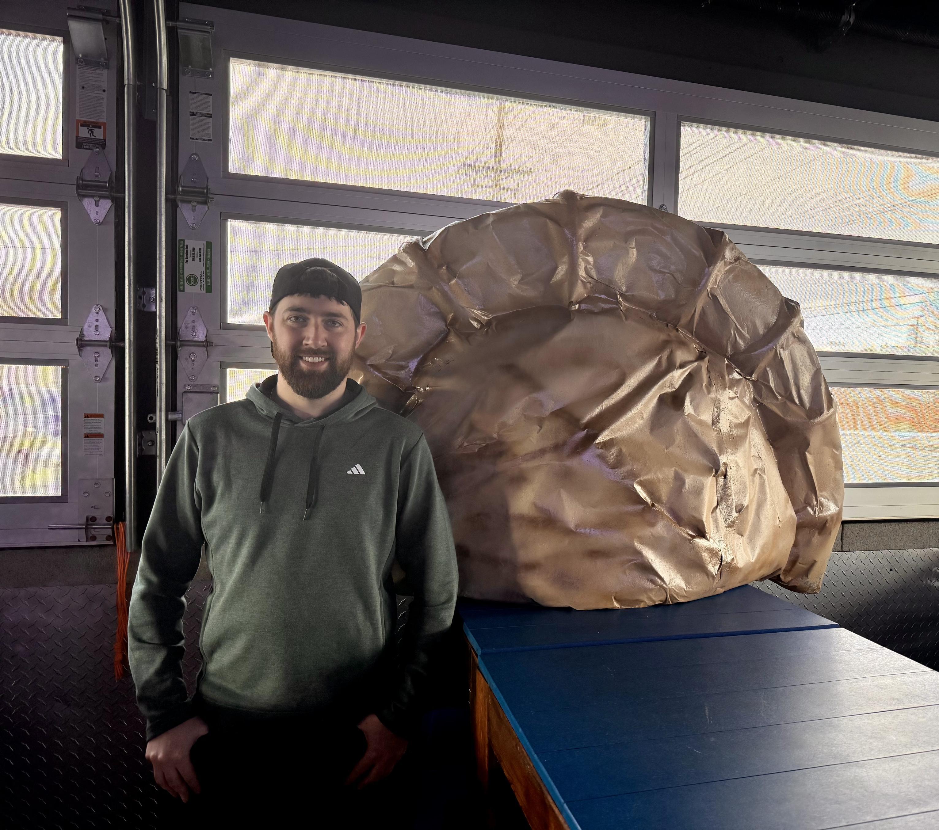 Man and a pierogi sculpture