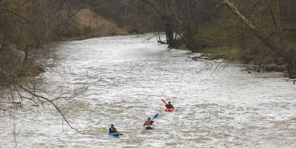 Writer Sheehan Hannan (green kayak) paddles through the Cuyahoga Valley National Park.