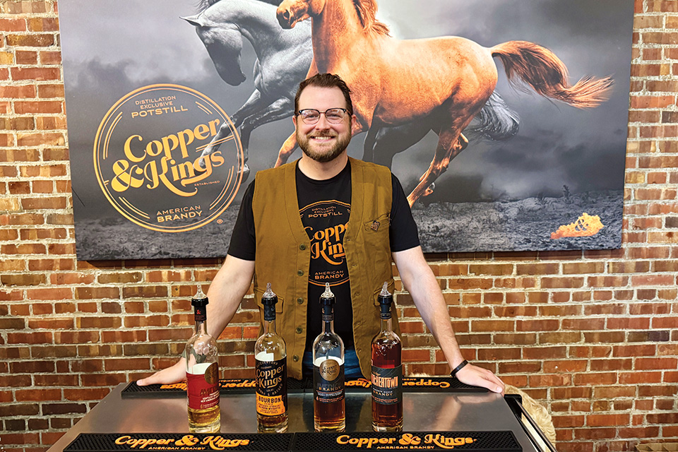 Bartender with brandy varieties at Copper & Kings in Louisville, Kentucky (photo by Terri Colby) Bartender with brandy varieties at Copper & Kings in Louisville, Kentucky (photo by Terri Colby)