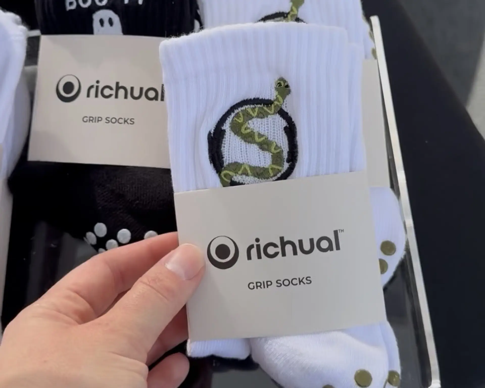 white sock with snake emblem