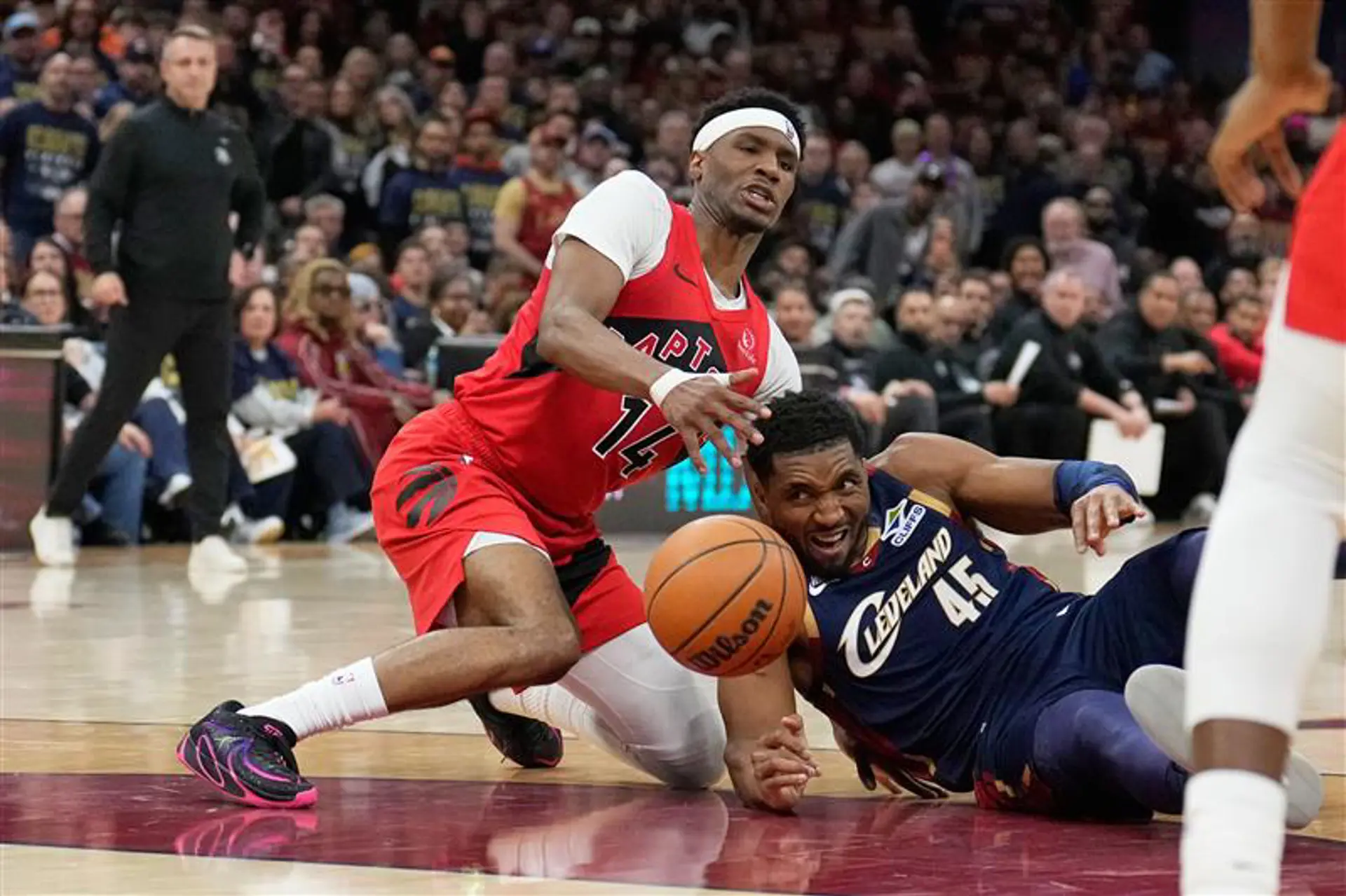 Raptors and Cavaliers fight for the ball in Cleveland during Game Two of the Eastern Conference playoffs