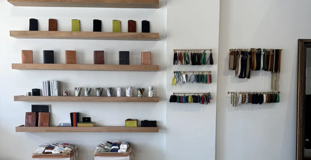 shelves of leather notebooks and leather tassels for handnbags