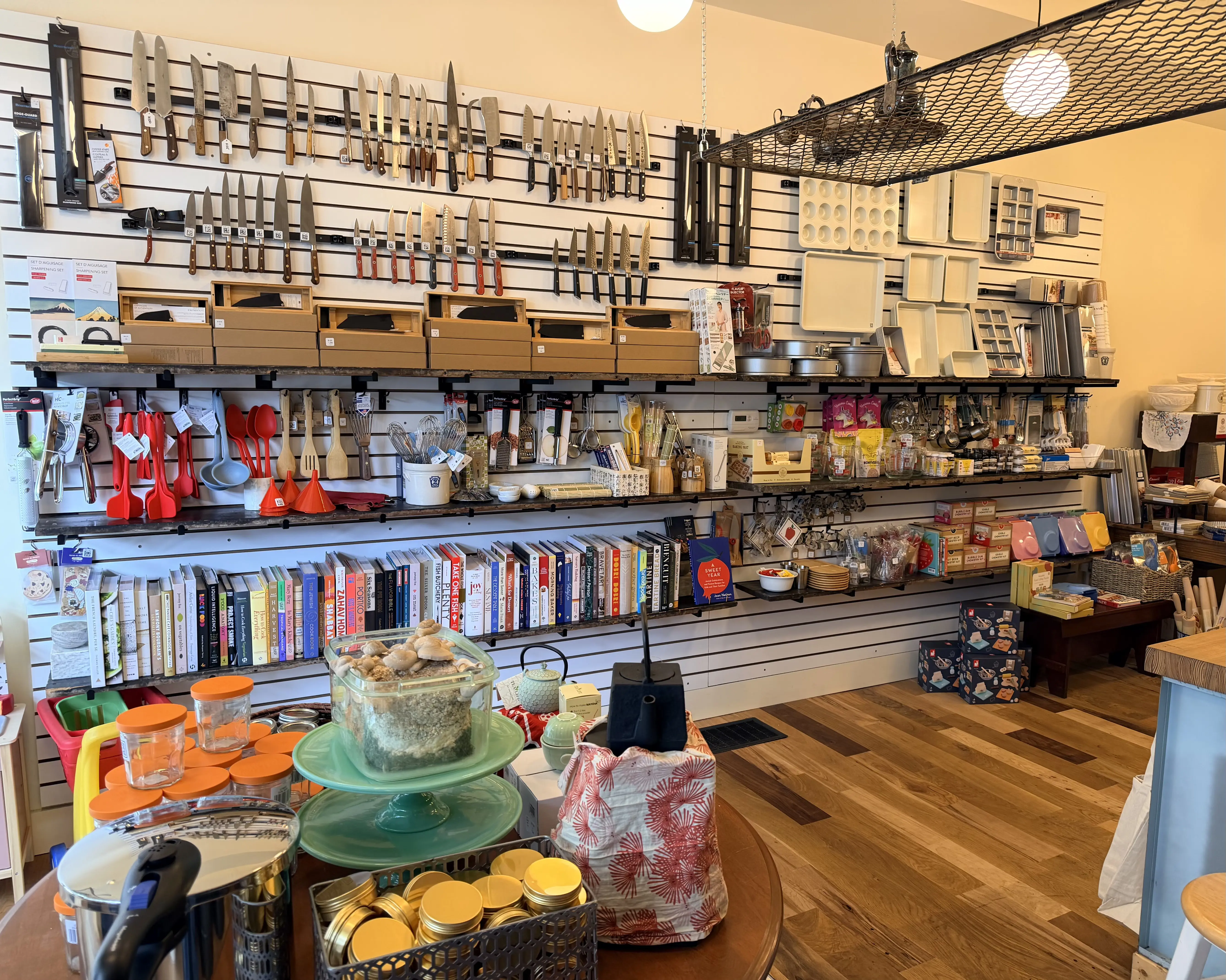 shelves of knives and kitchen equipment