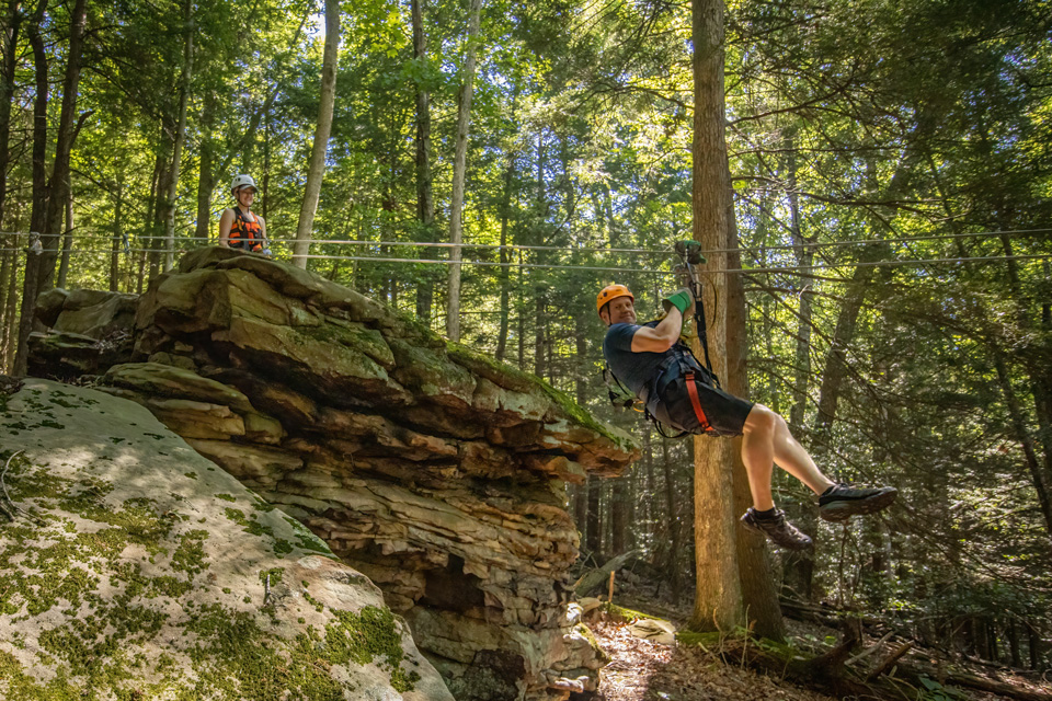 People on zip line at Treetops Zipline Canopy Tour in Lansing, West Virginia (photo courtesy of Treetops Zipline Canopy Tours) People on zip line at Treetops Zipline Canopy Tour in Lansing, West Virginia (photo courtesy of Treetops Zipline Canopy Tours)