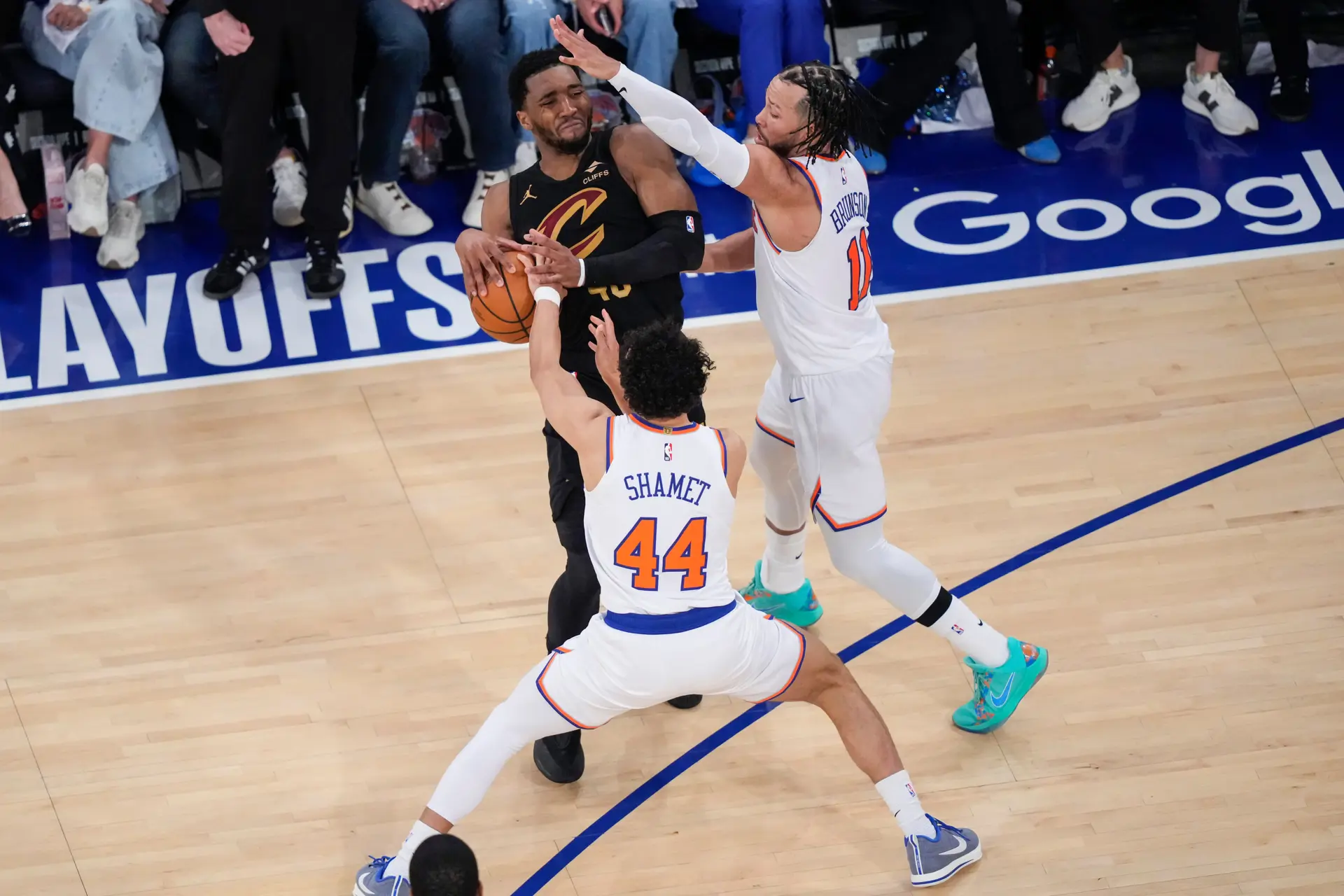 Donovan Mitchell battles two New York Knicks, Photographed by AP Photo