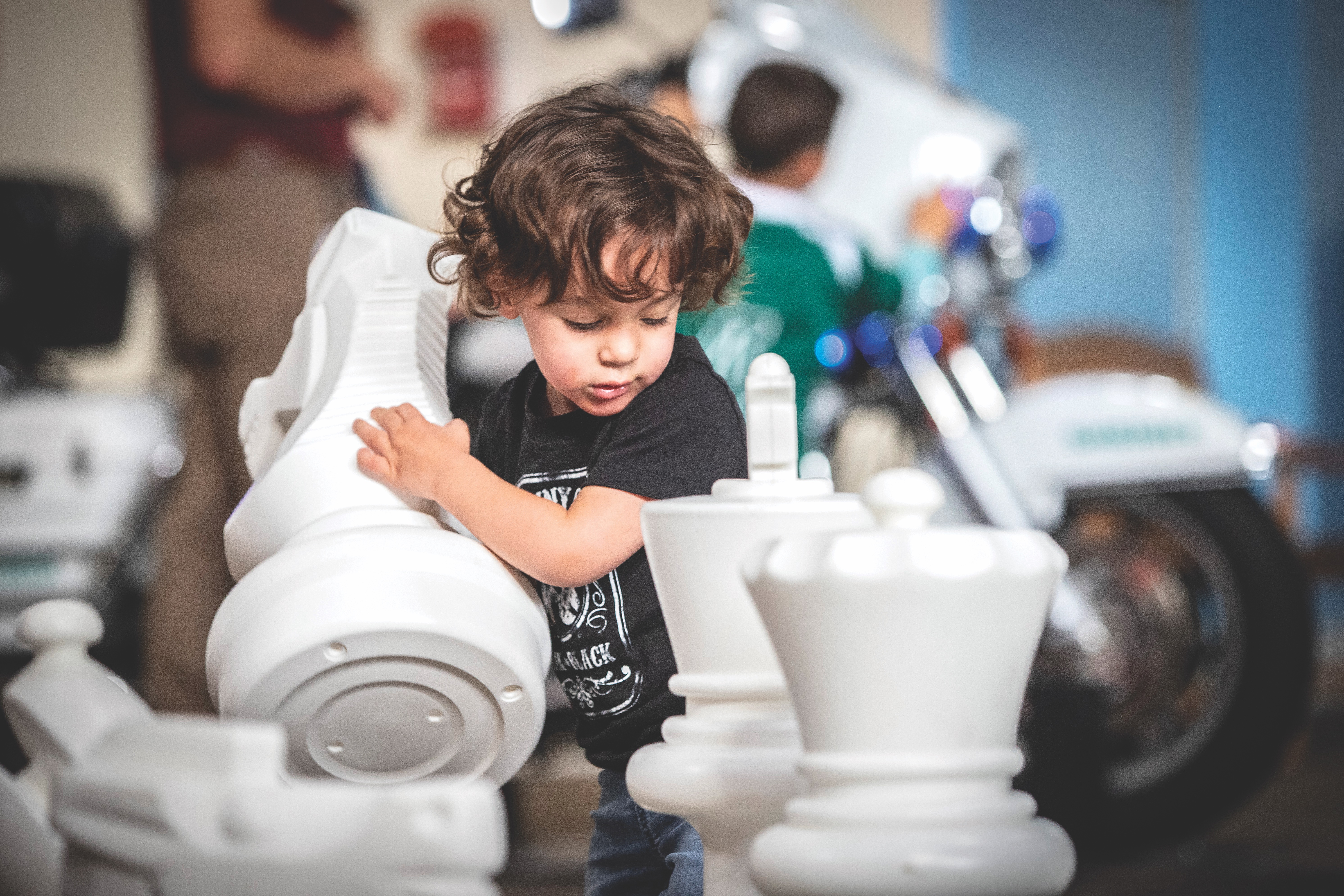 Child playing with giant chess set at Children's Museum Of Memphis in Memphis, Tennessee (photo by Disciple Photo) Child playing with giant chess set at Children's Museum Of Memphis in Memphis, Tennessee (photo by Disciple Photo)