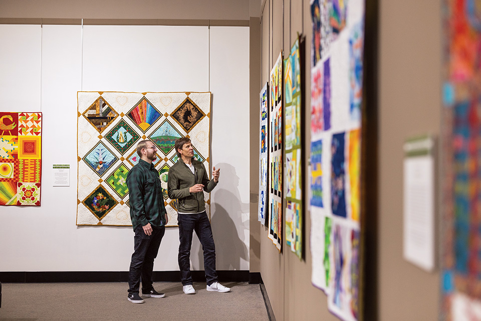 Men looking at quilts at National Quilt Museum in Paducah, Kentucky (photo courtesy of Paducah Convention & Visitors Bureau) Men looking at quilts at National Quilt Museum in Paducah, Kentucky (photo courtesy of Paducah Convention & Visitors Bureau)