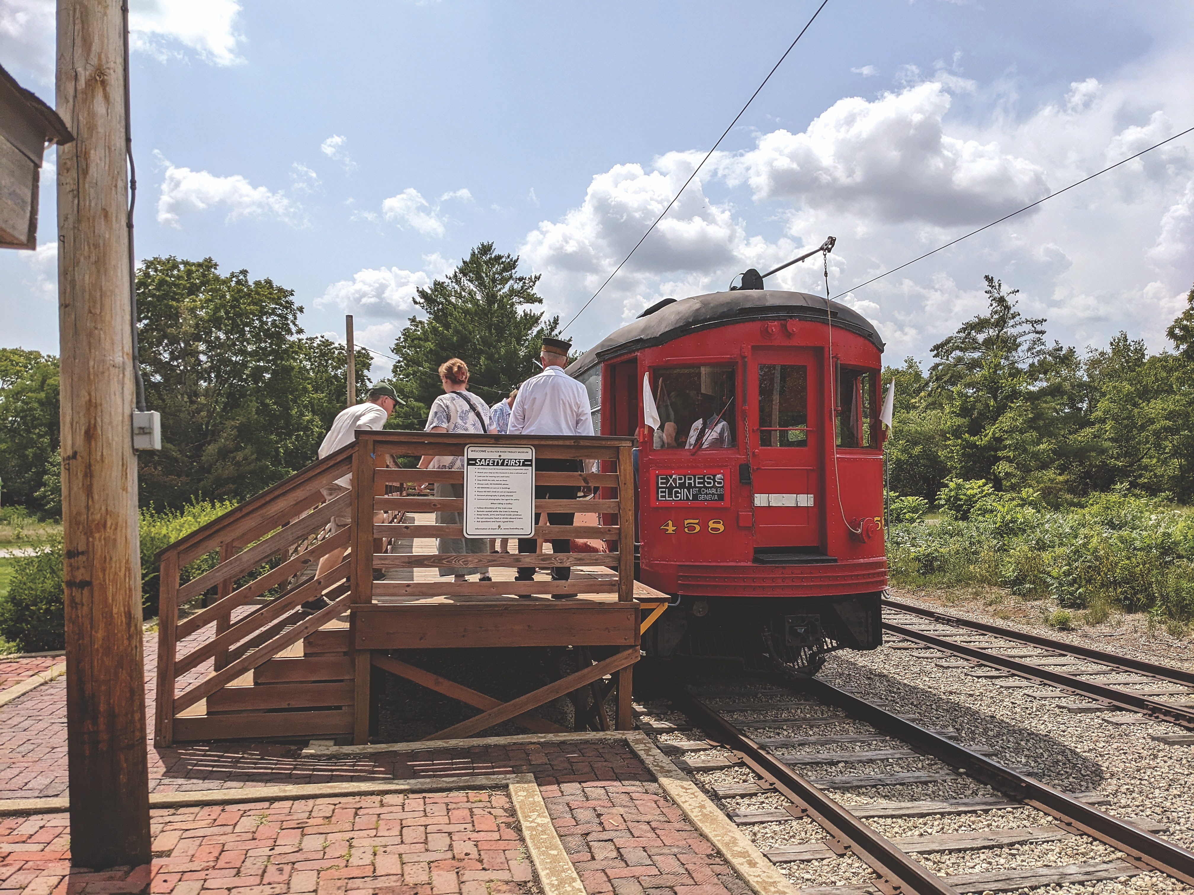 People standing on train platform next to red trolley car at Fox River Trolley Museum in South Elgin, Illinois (photo courtesy of Fox River Trolley Museum) People standing on train platform next to red trolley car at Fox River Trolley Museum in South Elgin, Illinois (photo courtesy of Fox River Trolley Museum)