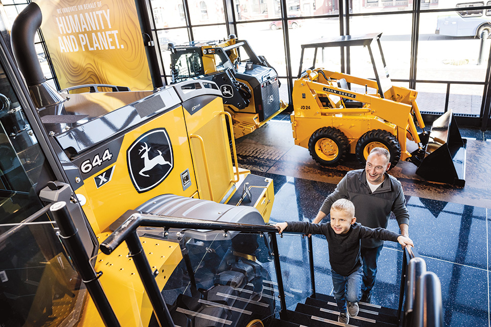 Dad and son at John Deere Pavilion in Moline, Illinois (photo courtesy of John Deere) Dad and son at John Deere Pavilion in Moline, Illinois (photo courtesy of John Deere)