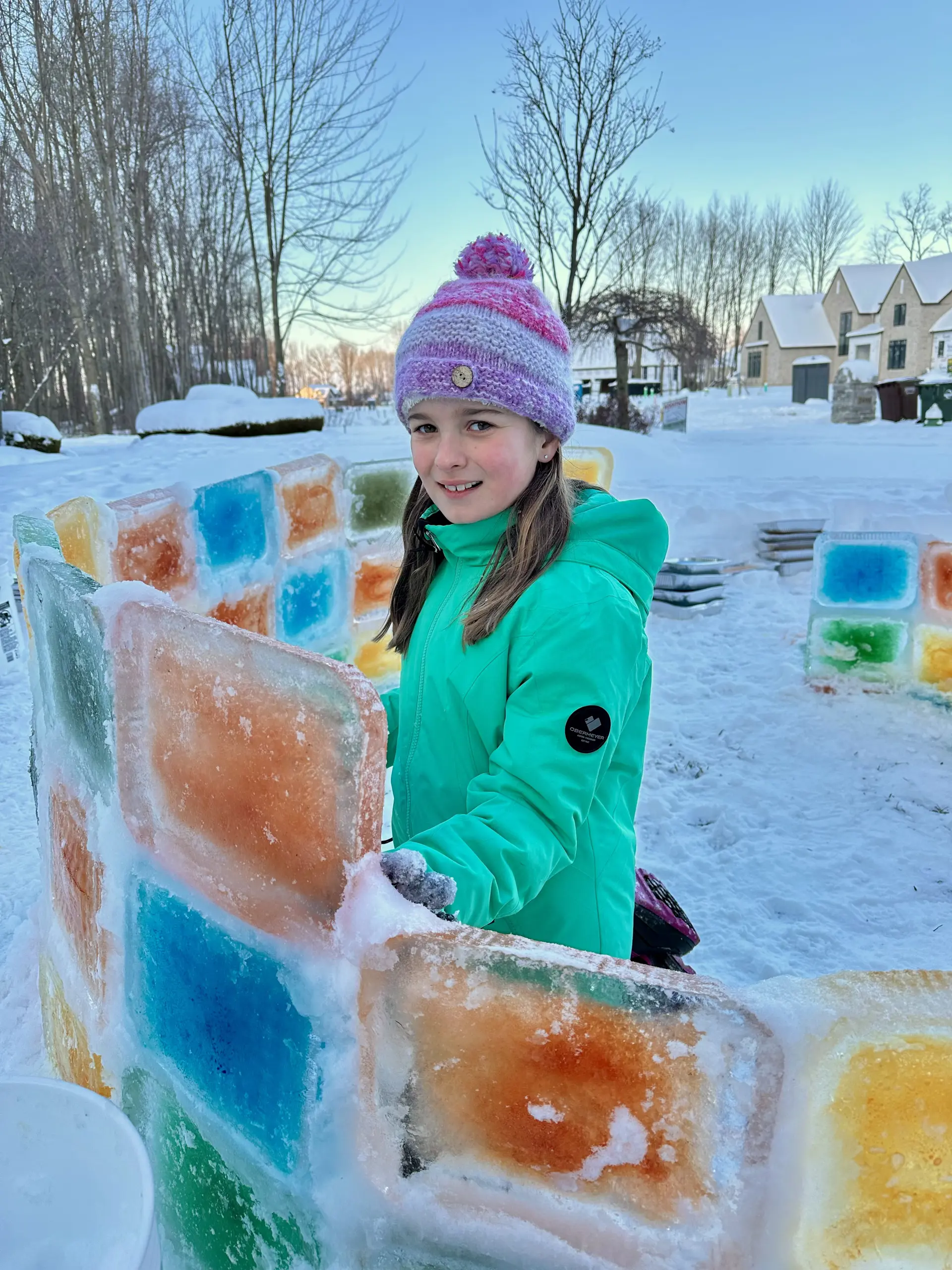 Person building an igloo.