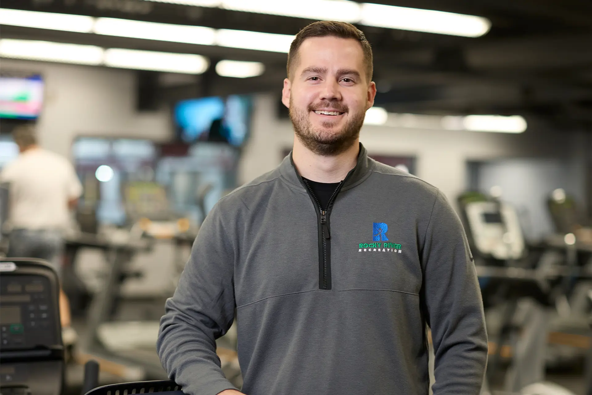 Brad Wisniewski standing among exercise equipment