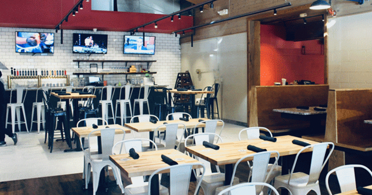 Interior of Immigrant Son Brewing showing the dining room and bar area
