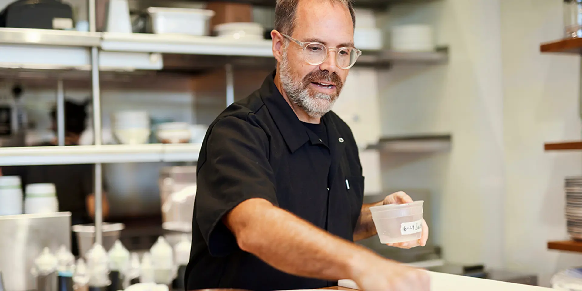 Douglas Katz cooking in a kitchen.