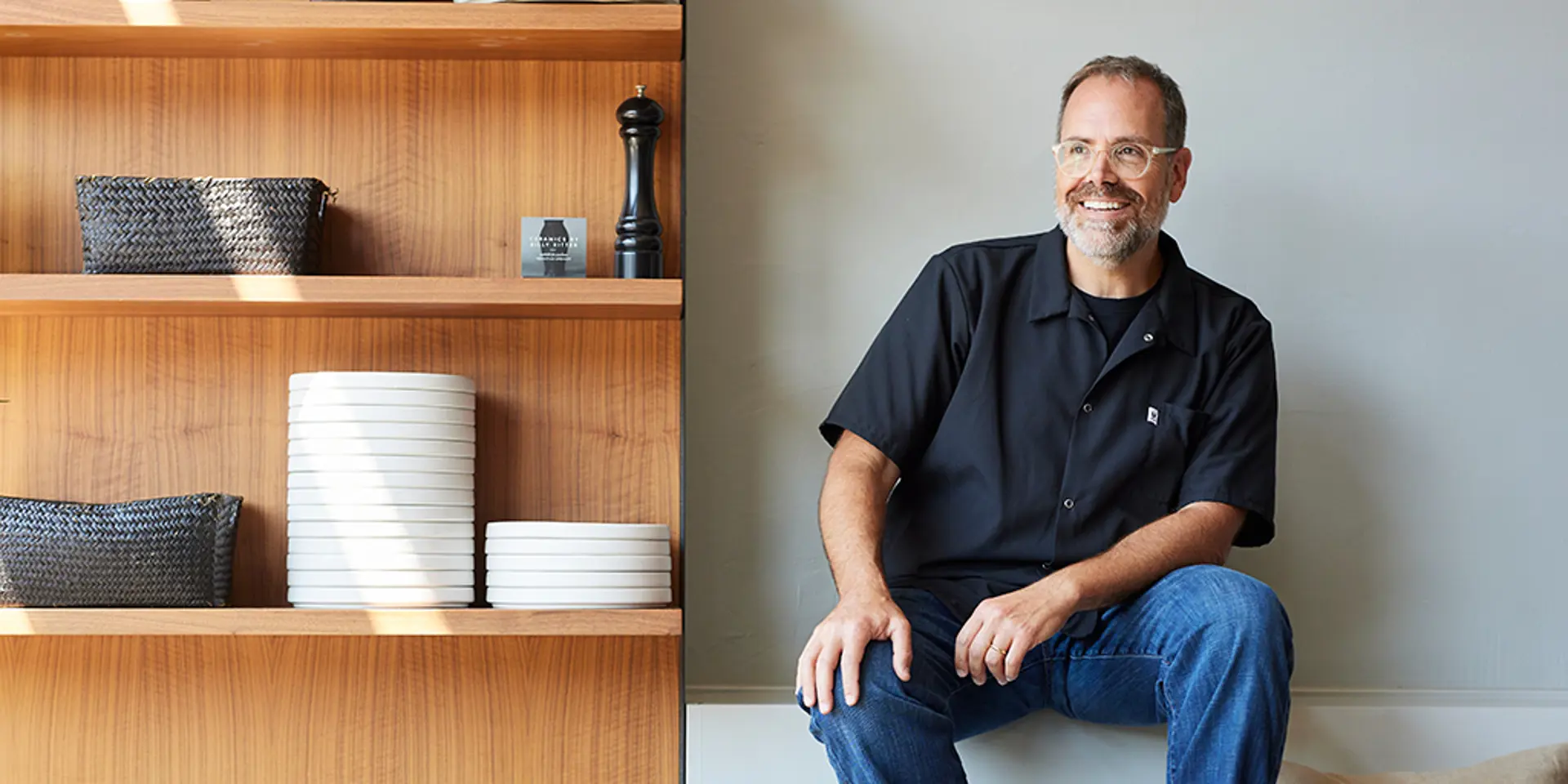 Douglas Katz sitting in his restaurant Zhug.