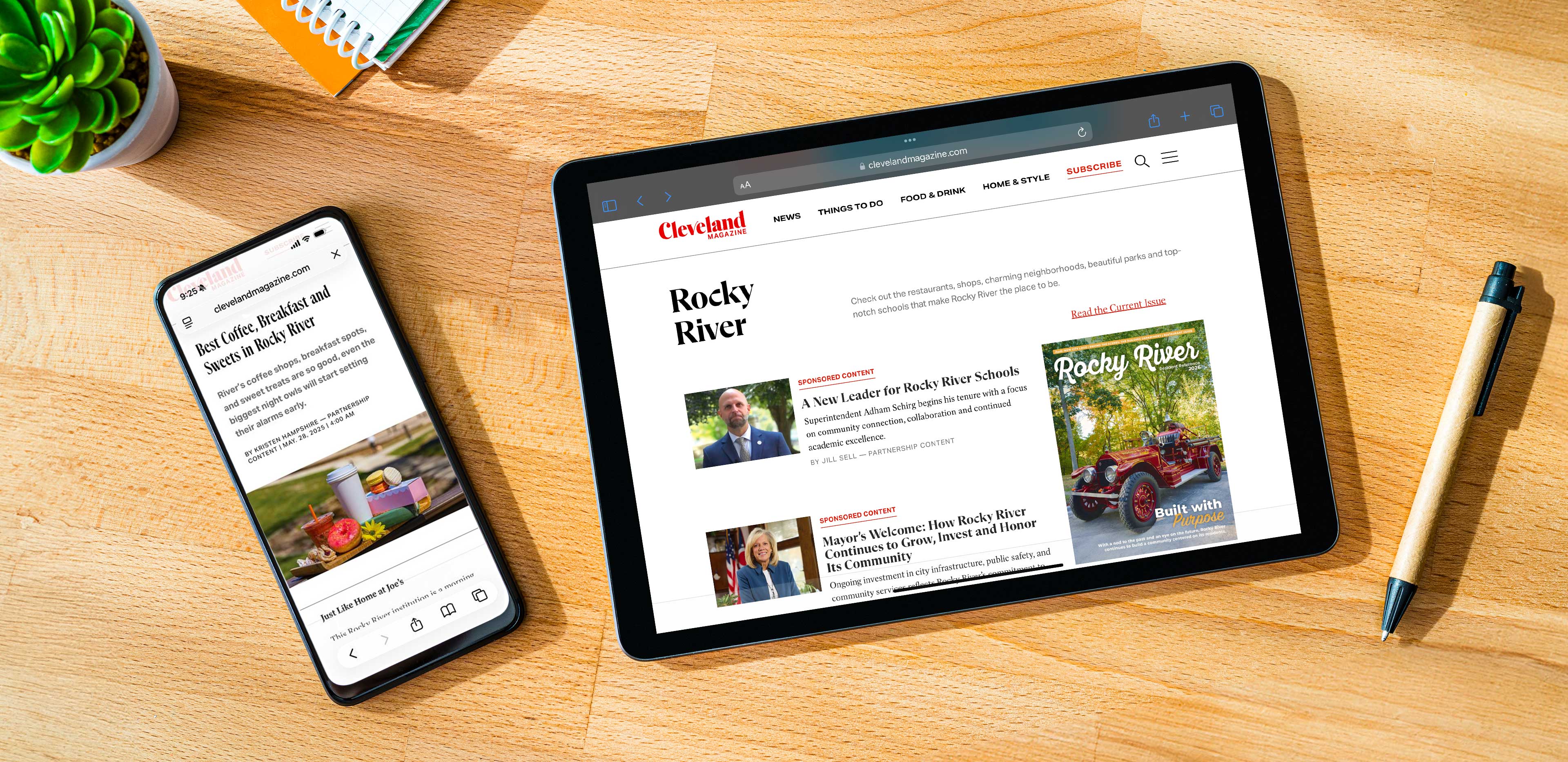 A phone and a tablet on a wooden desktop, both showing Rocky River stories on ClevelandMagazine.com