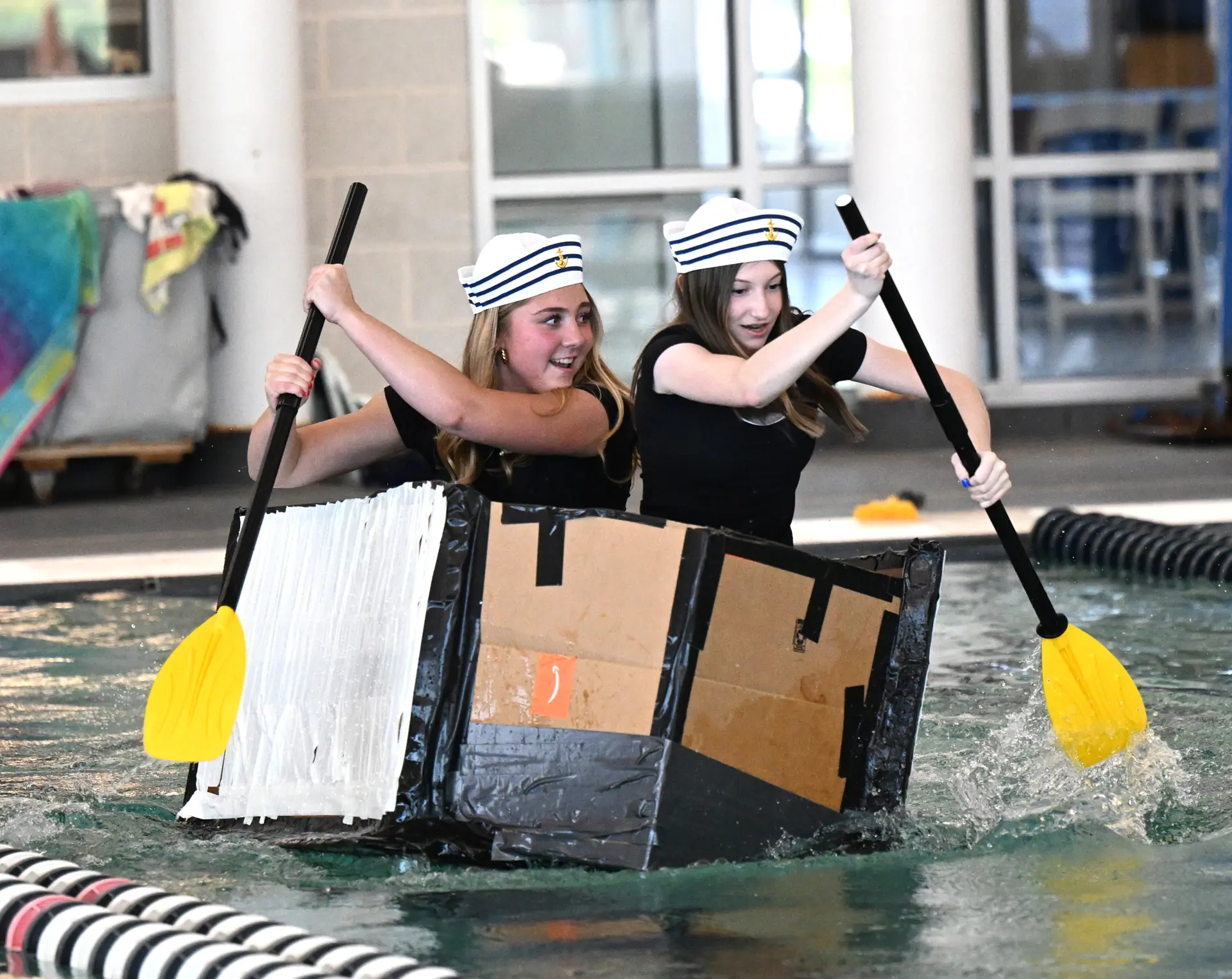 girls in a makeshift boat