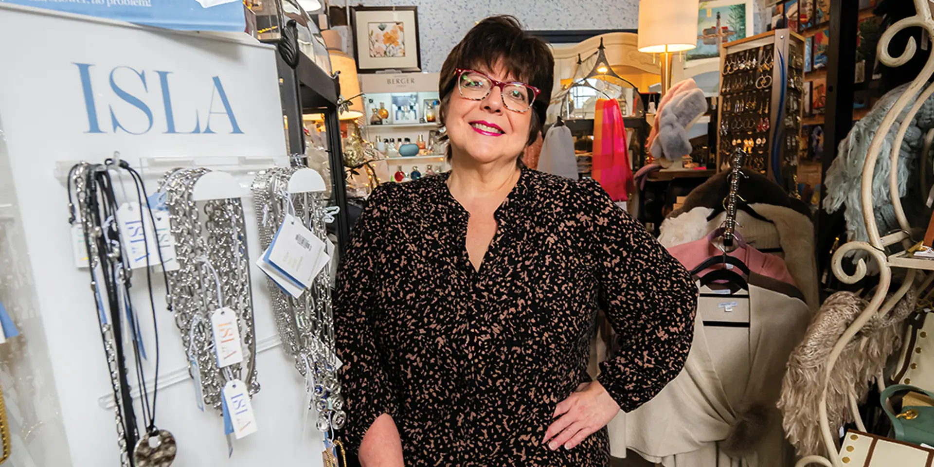 a woman standing in a store, smiling